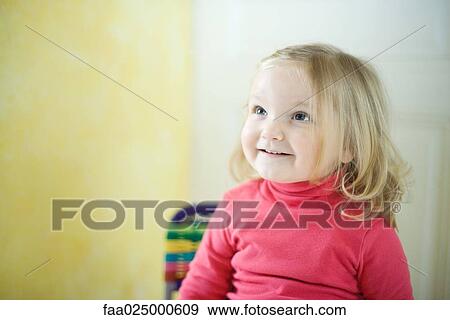 Blonde toddler girl smiling, looking up View Large Photo Image Stock Photo - Blonde toddler girl smiling, looking up. Fotosearch