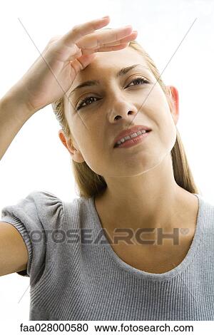 Blonde woman shading eyes, portrait View Large Photo Image Stock Image - Blonde woman shading eyes, portrait. Fotosearch