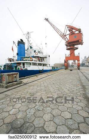Boat docked in port View Large Photo Image Stock Image - Boat docked in port. Fotosearch