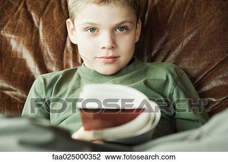 Boy reading book View Large Photo Image Stock Image - Boy reading book. Fotosearch