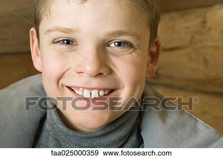 Boy smiling at camera, portrait View Large Photo Image Stock Photo - Boy smiling at camera, portrait. Fotosearch