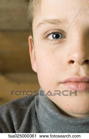 Boy's face, looking at camera, cropped view View Large Photo Image Stock Image - Boy's face, looking at camera, cropped view. Fotosearch
