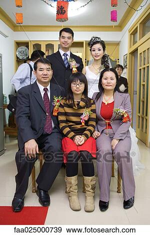 Bride and groom with family, group portrait, full length, front view View Large Photo Image Stock Photo - Bride and groom with family, group portrait, full length, front view. Fotosearch