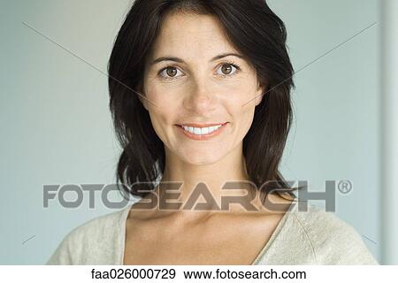 Brunette woman, smiling at camera, head and shoulders, portrait View Large Photo Image Stock Photo - Brunette woman, smiling at camera, head and shoulders, portrait. Fotosearch