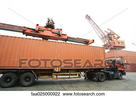 Cargo container being loaded onto truck View Large Photo Image Stock Image - Cargo container being loaded onto truck. Fotosearch