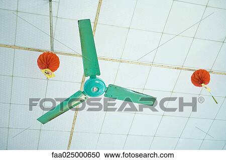 Ceiling fan and decorations, low angle view View Large Photo Image Stock Image - Ceiling fan and decorations, low angle view. Fotosearch