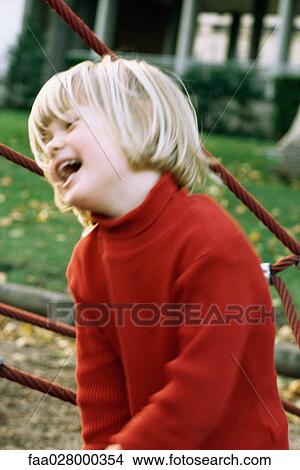 Child outdoors, smiling, looking away View Large Photo Image Picture - Child outdoors, smiling, looking away. Fotosearch