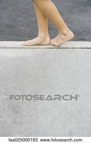 Child walking along crack in sidewalk, cropped view of feet View Large Photo Image Stock Image - Child walking along crack in sidewalk, cropped view of feet. Fotosearch