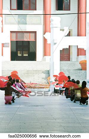 China, women dancing with fans, on esplanade View Large Photo Image Stock Photograph - China, women dancing with fans, on esplanade. Fotosearch