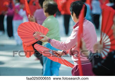 China, women dancing with fans, outdoors View Large Photo Image Stock Photography - China, women dancing with fans, outdoors. Fotosearch