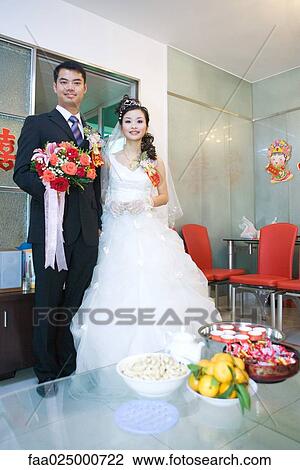 Chinese wedding, bride and groom, full length portrait View Large Photo Image Stock Image - Chinese wedding, bride and groom, full length portrait. Fotosearch