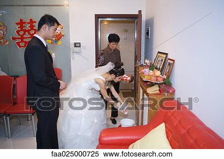 Chinese wedding, bride taking offering to ancestral shrine View Large Photo Image Stock Photography - Chinese wedding, bride taking offering to ancestral shrine. Fotosearch