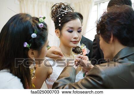 Chinese wedding, giving of jewelry to the bride View Large Photo Image Stock Image - Chinese wedding, giving of jewelry to the bride. Fotosearch