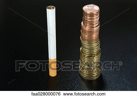 Cigarette next to stack of coins, close-up View Large Photo Image Stock Photograph - Cigarette next to stack of coins, close-up. Fotosearch