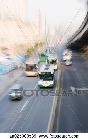 City buses, blurred motion, high angle view View Large Photo Image Stock Photo - City buses, blurred motion, high angle view. Fotosearch