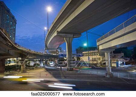 City traffic under overpass at night View Large Photo Image Stock Photo - City traffic under overpass at night. Fotosearch