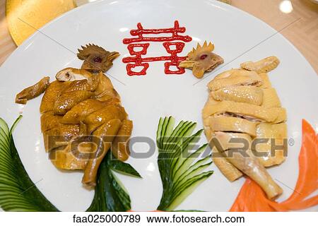 Close-up of cooked chickens on plate with Chinese ideogram View Large Photo Image Stock Photo - Close-up of cooked chickens on plate with Chinese ideogram. Fotosearch