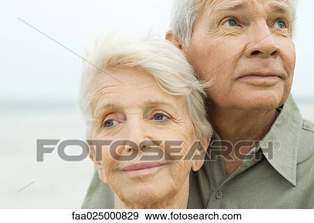 Close-up of senior couple looking away, smiling, portrait View Large Photo Image Stock Photo - Close-up of senior couple looking away, smiling, portrait. Fotosearch