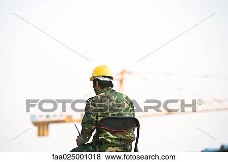 Construction worker, rear view View Large Photo Image Stock Photo - Construction worker, rear view. Fotosearch