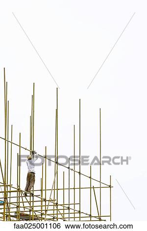 Construction worker working at construction site View Large Photo Image Stock Photograph - Construction worker working at construction site. Fotosearch