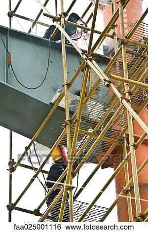 Stock Photograph - Construction workers. Fotosearch