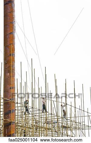 Construction workers working at construction site View Large Photo Image Picture - Construction workers working at construction site. Fotosearch