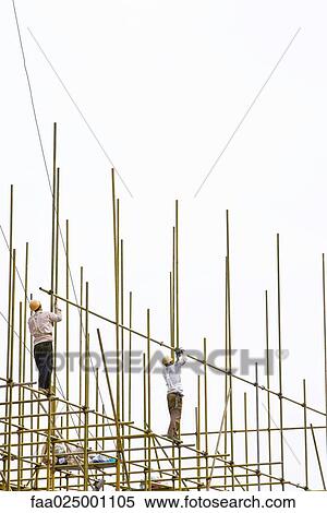 Construction workers working at construction site View Large Photo Image Stock Photography - Construction workers working at construction site. Fotosearch