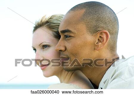 Couple cheek to cheek, looking away together, profile View Large Photo Image Stock Image - Couple cheek to cheek, looking away together, profile. Fotosearch