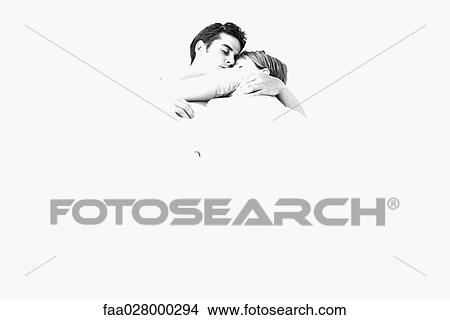 Couple embracing, eyes closed, overexposure View Large Photo Image Picture - Couple embracing, eyes closed, overexposure. Fotosearch