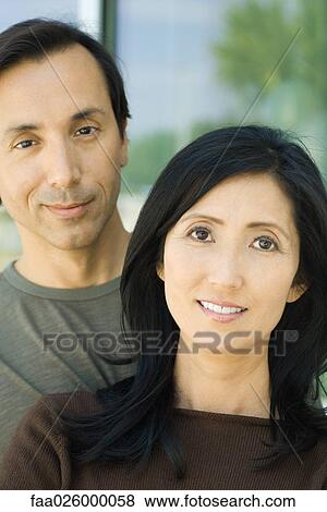 Couple smiling at camera together, portrait View Large Photo Image Stock Photo - Couple smiling at camera together, portrait. Fotosearch