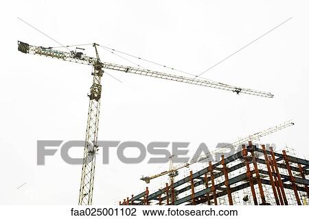 Stock Image - Crane and building frame. Fotosearch