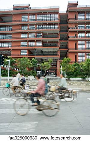 Cyclists riding in street, blurred motion View Large Photo Image Stock Image - Cyclists riding in street, blurred motion. Fotosearch