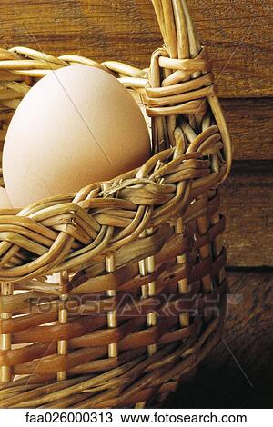 Egg in wicker basket, close-up View Large Photo Image Stock Image - Egg in wicker basket, close-up. Fotosearch
