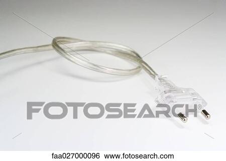 Stock Photograph - Electric cord and plug, close-up. Fotosearch