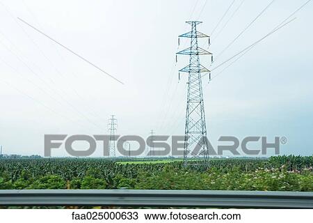 Electric pylons seen from highway View Large Photo Image Stock Image - Electric pylons seen from highway. Fotosearch