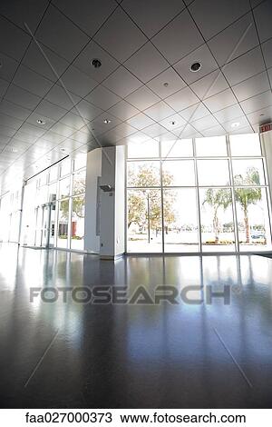 Empty hall with large windows and sunlight View Large Photo Image Stock Image - Empty hall with large windows and sunlight. Fotosearch