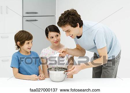 Father and two children baking together, man using electric mixer View Large Photo Image Stock Photo - Father and two children baking together, man using electric mixer. Fotosearch