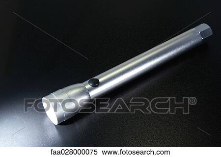 Flashlight, turned on, close-up View Large Photo Image Stock Photography - Flashlight, turned on, close-up. Fotosearch