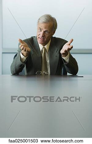 gesture, leaning on elbow, businessman, hand raised, leader, ceo View Large Photo Image Stock Image - gesture, leaning on elbow, businessman, hand raised, leader, ceo. Fotosearch