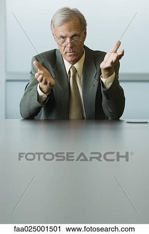 gesture, leaning on elbow, glasses, businessman, hand raised, ceo View Large Photo Image Stock Image - gesture, leaning on elbow, glasses, businessman, hand raised, ceo. Fotosearch