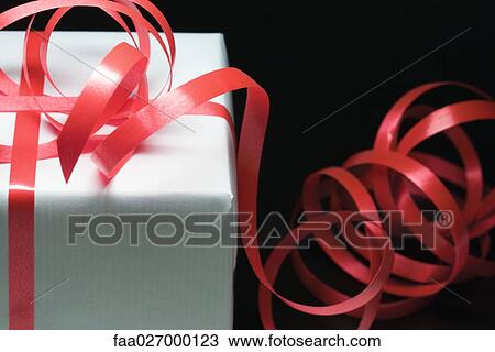 Gift wrapped in ribbon, close-up View Large Photo Image Stock Image - Gift wrapped in ribbon, close-up. Fotosearch
