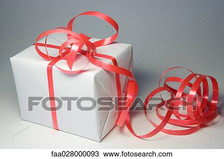 Gift wrapped in ribbon, close-up View Large Photo Image Stock Image - Gift wrapped in ribbon, close-up. Fotosearch