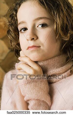 Girl holding hands under chin, portrait View Large Photo Image Stock Photography - Girl holding hands under chin, portrait. Fotosearch