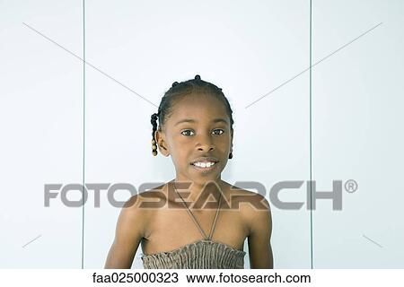 Girl smiling at camera, portrait View Large Photo Image Stock Image - Girl smiling at camera, portrait. Fotosearch
