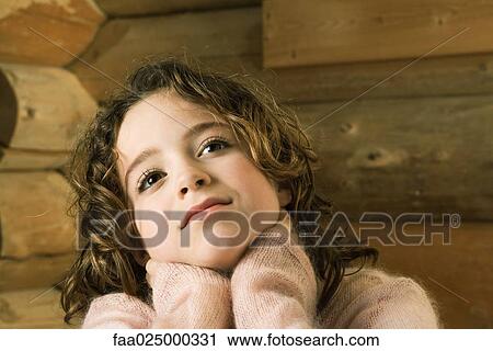 Girl with hands over neck, looking up View Large Photo Image Stock Image - Girl with hands over neck, looking up. Fotosearch