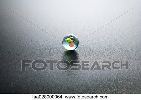 Glass marble, close-up View Large Photo Image Picture - Glass marble, close-up. Fotosearch
