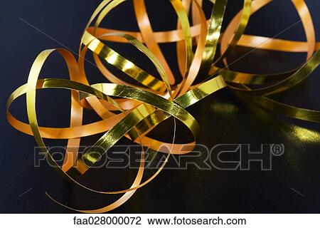 Gold-colored gift-wrap ribbon, close-up View Large Photo Image Stock Image - Gold-colored gift-wrap ribbon, close-up. Fotosearch