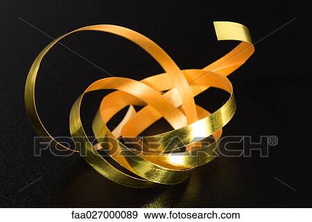 Gold gift-wrap ribbon View Large Photo Image Stock Photo - Gold gift-wrap ribbon. Fotosearch