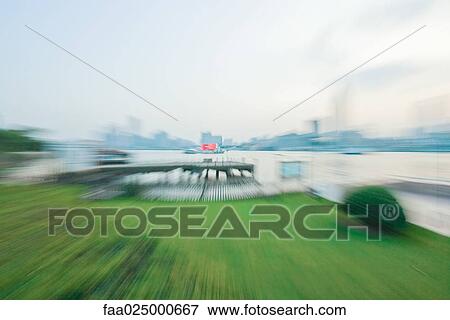 Green space next to waterfront, blurred View Large Photo Image Stock Photo - Green space next to waterfront, blurred. Fotosearch