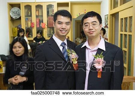 Groom standing beside best man, both smiling at camera, portrait View Large Photo Image Stock Photo - Groom standing beside best man, both smiling at camera, portrait. Fotosearch